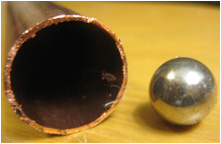 Sphere magnet and copper pipe.