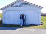 Bev and Rex under airport sign